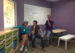 Boulder Parents take the thinker pose after a day of painting the lab - led by our kids!