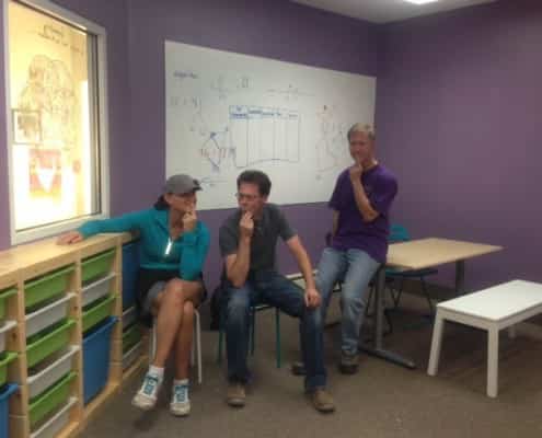 Boulder Parents take the thinker pose after a day of painting the lab - led by our kids!