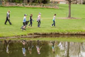 students clean up park